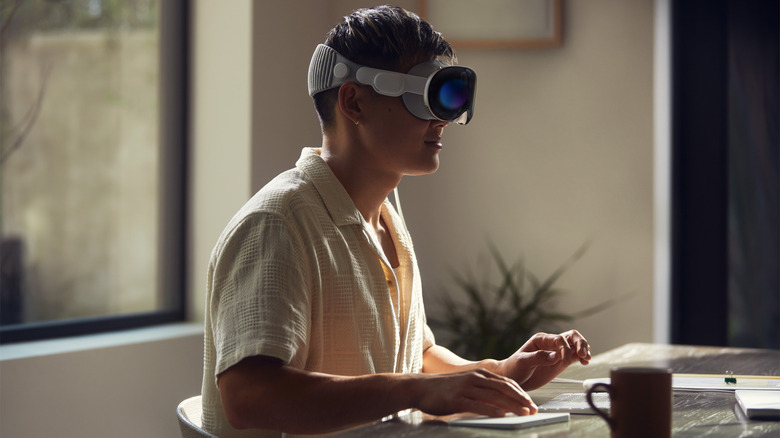 man working on Apple Vision Pro
