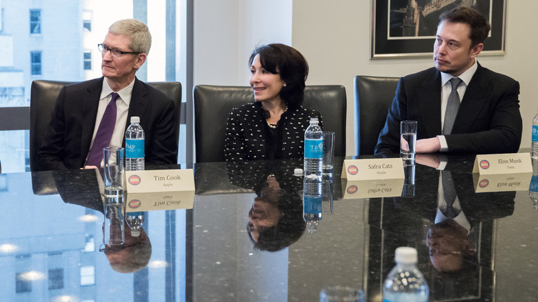 Tim Cook and Elon Musk flank Oracle's Safra Cruz in 2016
