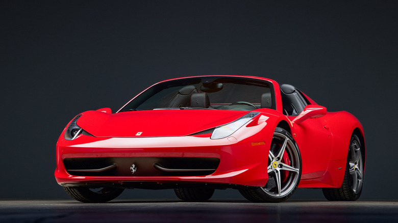 The Ferrari 458 Spider in Rosso Corsa red, front 3/4 view
