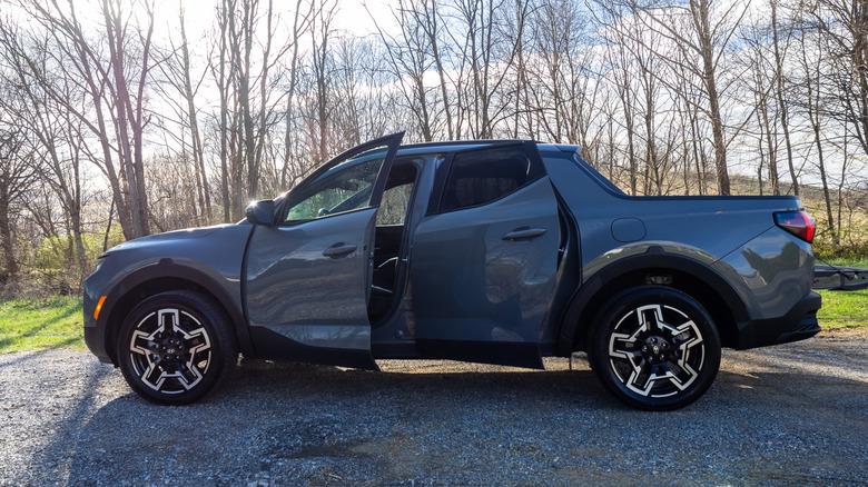 2026 Hyundai Santa Cruz driver's side profile with all doors and tailgate open