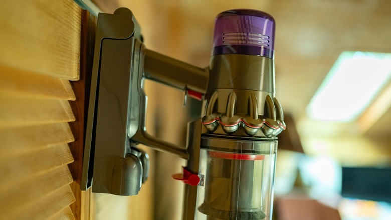 The Dyson V11 attached to its wall mounted station.