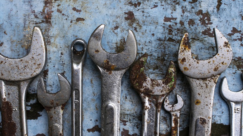 An array of rusted tools on display