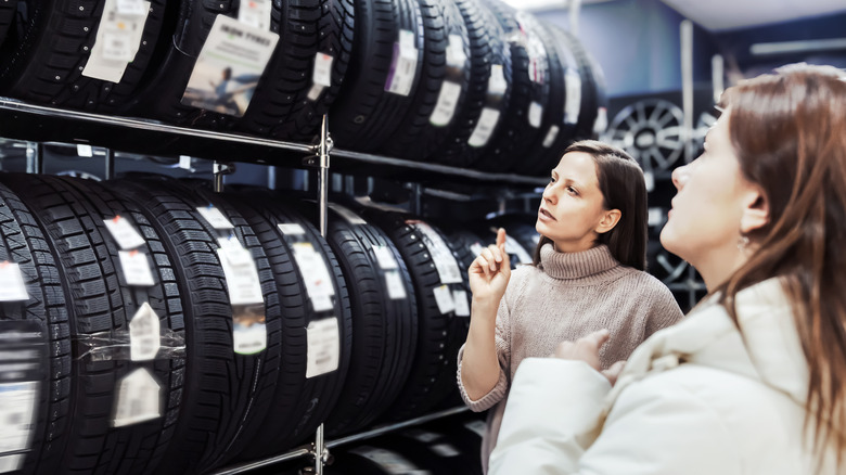 Two women shopping for tires