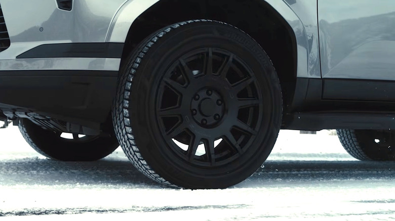 SUV with Bridgestone UltraWeather tires driving on a snowy road