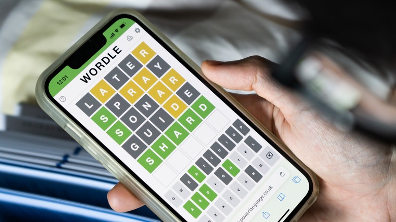 Wordle on iPhone in hand