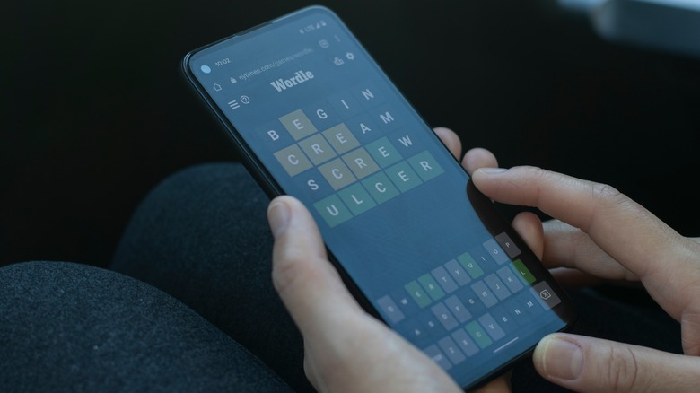 person playing Wordle on a smartphone