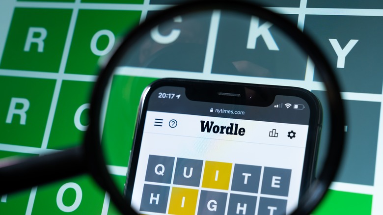 magnifying glass over Wordle puzzle