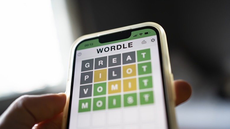 person playing Wordle on smartphone