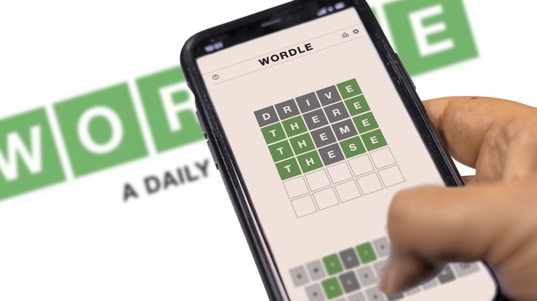 Person playing Wordle on smartphone