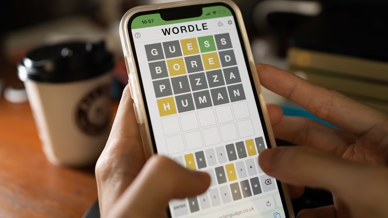 Person playing Wordle on smartphone