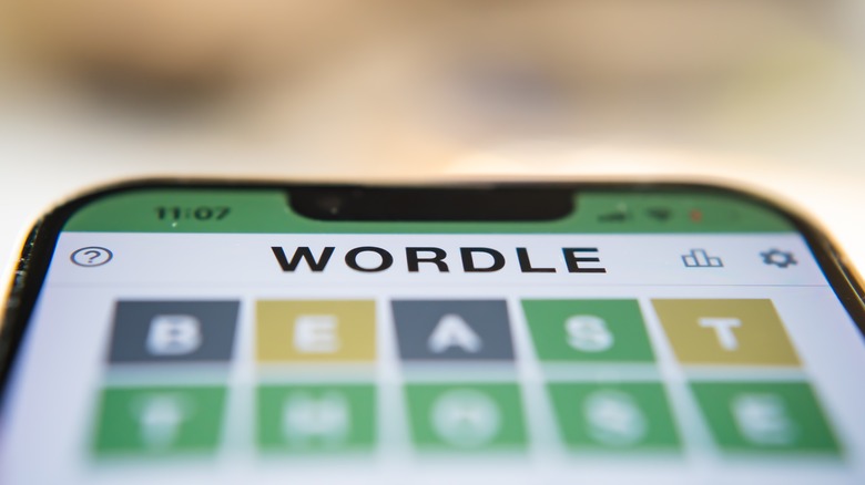 Person playing Wordle on smartphone