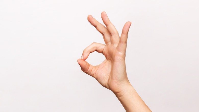 Female hand doing the OK gesture