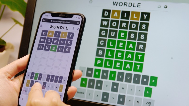 person playing Wordle on smartphone