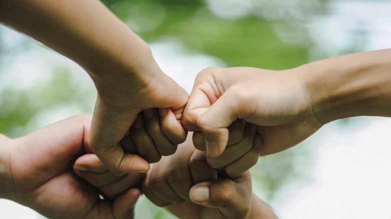 fists huddled together