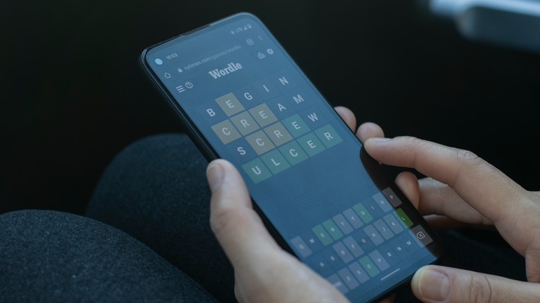 person playing Wordle on a smartphone