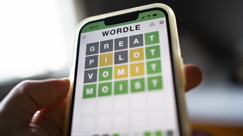 person playing Wordle on smartphone