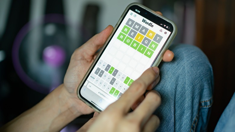 person playing Wordle on a smartphone