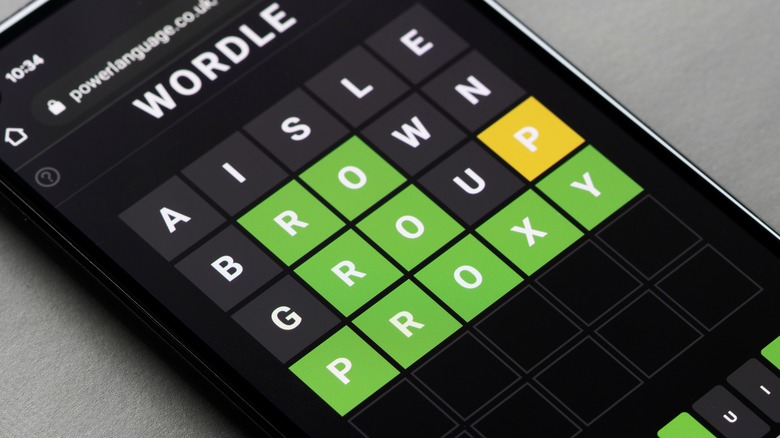 Playing the Wordle puzzle game on an Android smartphone.