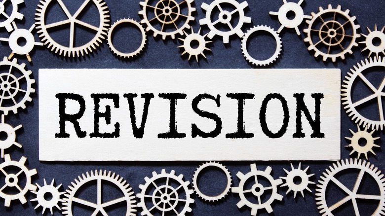 the word "revision" in metallic press