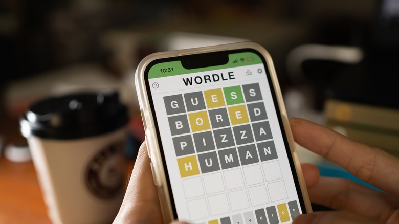 person playing Wordle on a smartphone