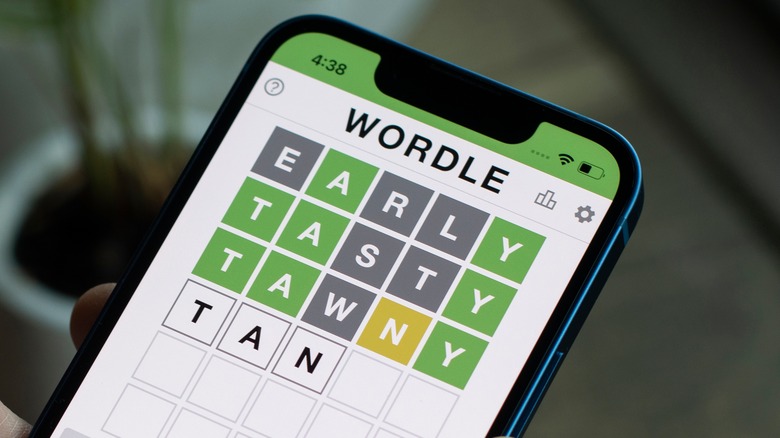 person playing Wordle on smartphone