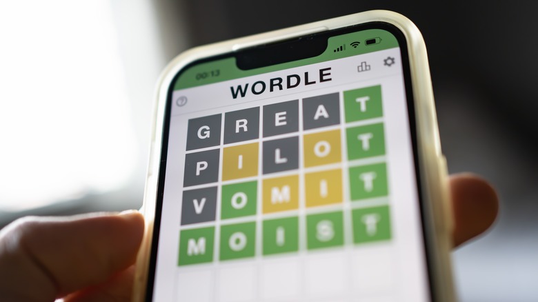 person playing Wordle on smartphone