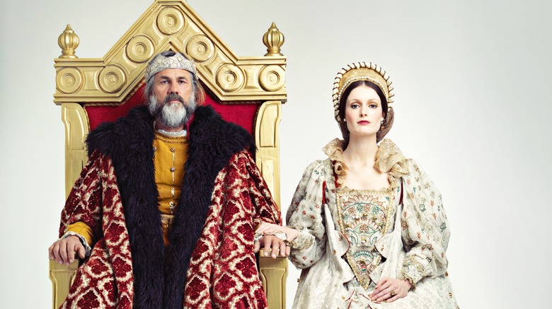 king and queen sitting on thrones