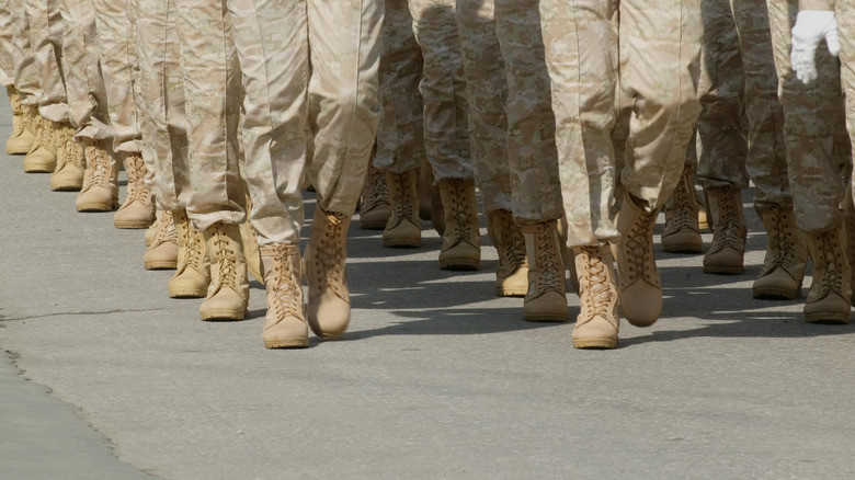 soldiers in uniform marching 