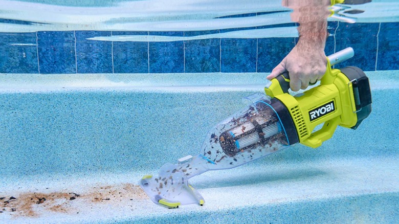 Ryobi 18V One+ Pool Vacuum in use in handheld mode