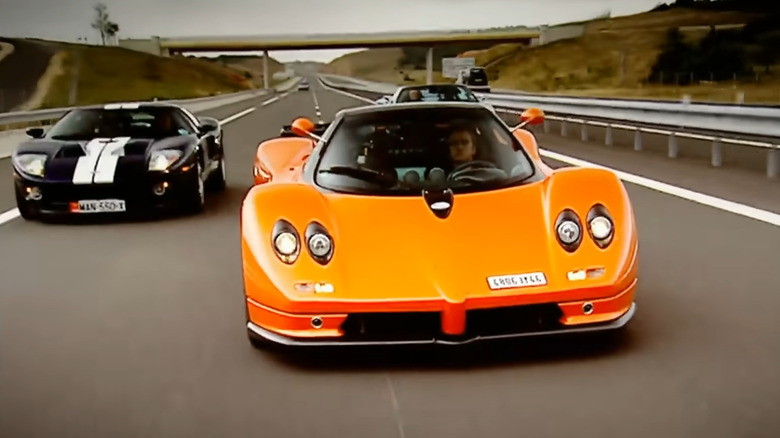 top gear hosts driving supercars on track