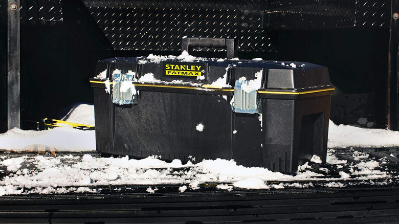 Stanley - 28 in. 9.2 Gallon Mobile Tool Box covered in snow in the bed of a truck