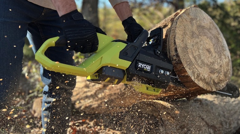 40V HP Brushless 20-inch Battery Chainsaw cutting into log