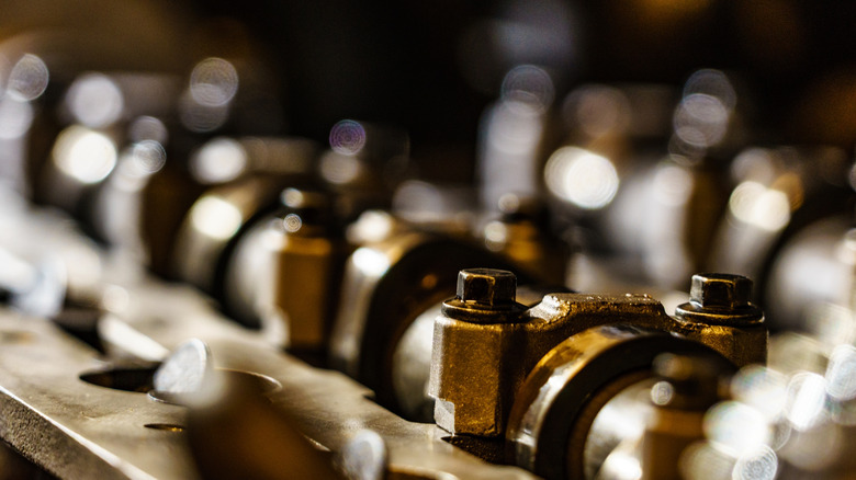 Close-up of camshaft bolts installed in engine, a typical use for TTY bolts