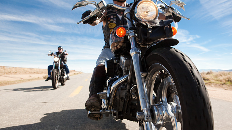 Two motorcyclists on long road