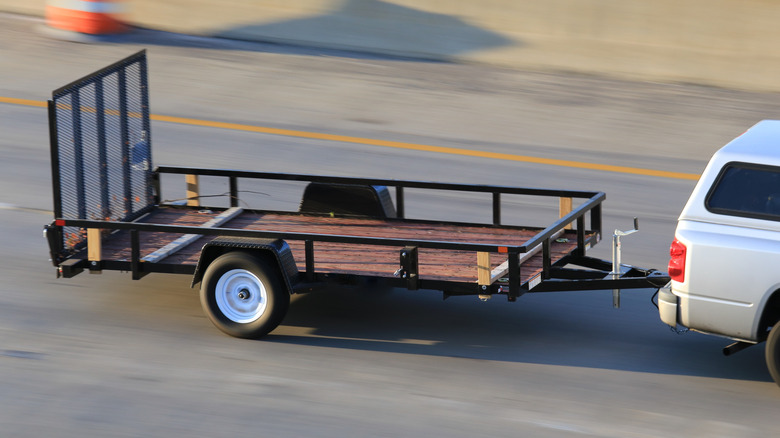 Truck towing a trailer on the highway