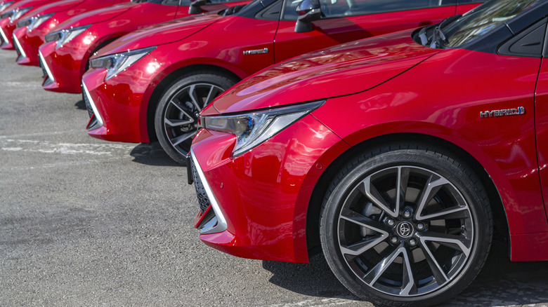 Series of red Toyota Corollas