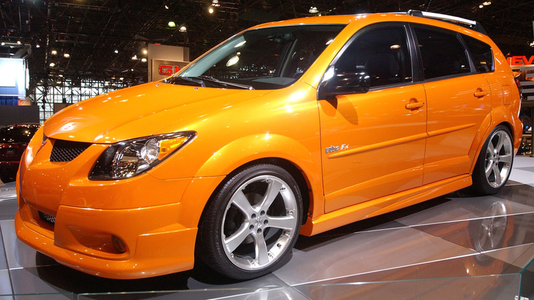 Orange Pontiac Vibe in show room