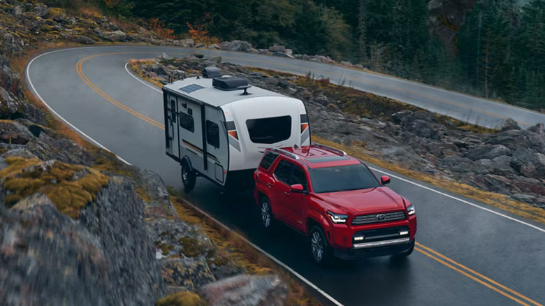 2025 Toyota 4Runner gas model towing a trailer on a highway
