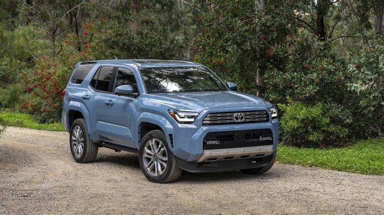 Front 3/4 view of a 2025 Toyota 4Runner on a gravel trail, light blue exterior