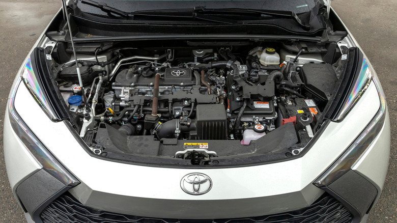 Shot of a Silver Toyota C-HR hybrid engine bay with the hood up.
