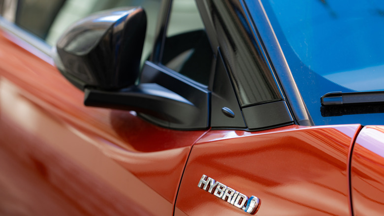 Close up shot of the front right shoulder on the Toyota C-HR in orange.