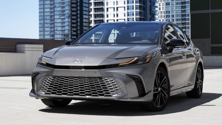 Front view of silver 2026 Toyota Camry parked on garage.