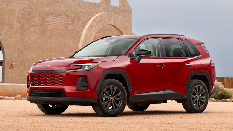 Front 3/4 view of red 2026 Toyota RAV4 Hybrid.