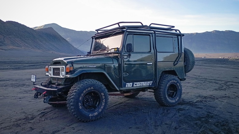 Toyota Land Cruiser FJ40 parked in mountainous terrain