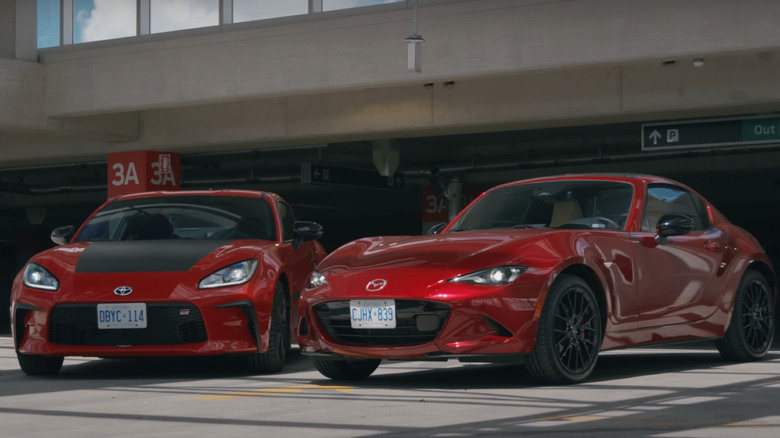 Red Mazda Miata parked next to Red Toyota GR 86