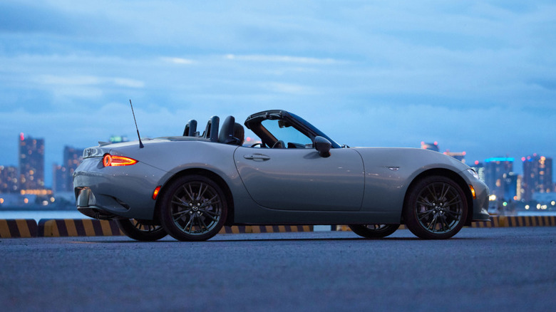 Mazda Miata against skyline at dusk