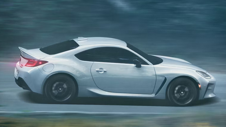 White Toyota GR86 driving through woods