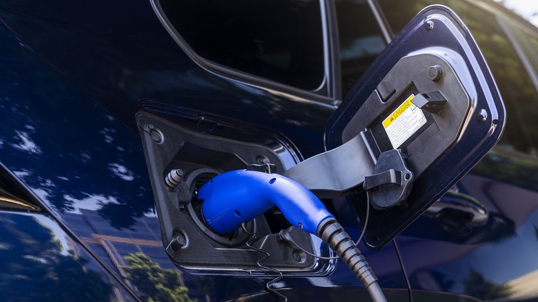 Close-up of a charging cable connected to Toyota RAV4 Prime Plug-In Hybrid