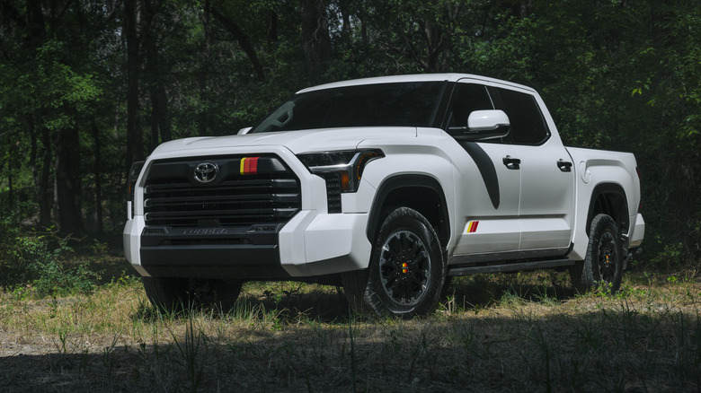 White 2025 Toyota Tundra parked in forest