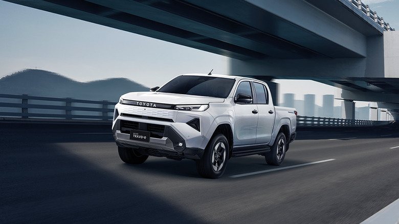 2027 Toyota Hilux BEV (Thailand-spec) prototype driving on highway